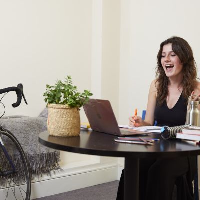 A girl sits at a desk